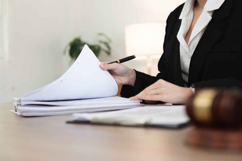 Attorney reviewing legal documents in an office