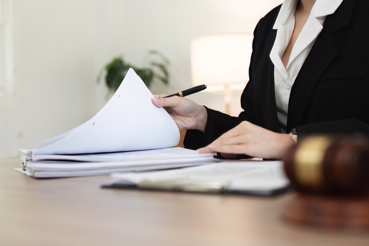 Attorney reviewing legal documents in an office